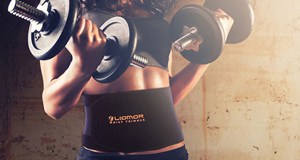 A woman wearing a waist trainer while exercising