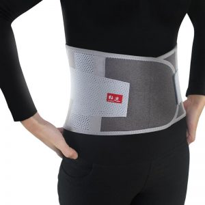 Model with Mcdavid waist trimmer belt on white background.