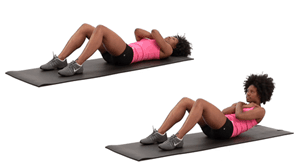 A black woman is doing the crunches on a placket