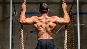 A strong man doing the back exercise