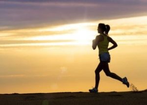 Woman running under sunshine