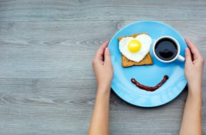 Smile for sweet breakfast in blue plate