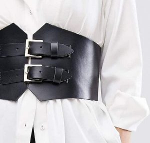 Black corset belt over a white shirt