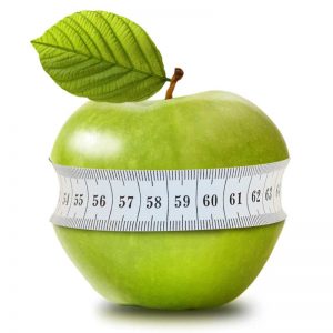 Green apple with measurement on white