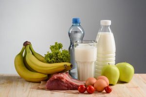 Health food and mineral water on the wooden table