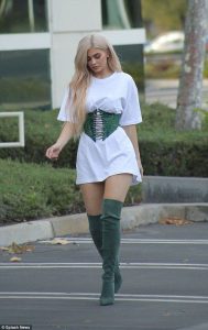 Kylie Jenner wearing an corset belt oversized T-shirt