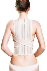 Woman wearing a posture correctors