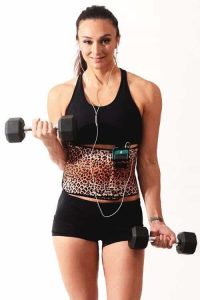 Woman wearing waist trimmer belt and doing exercise