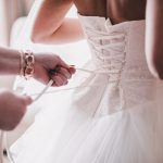 Bride wearing a white corset wedding dress